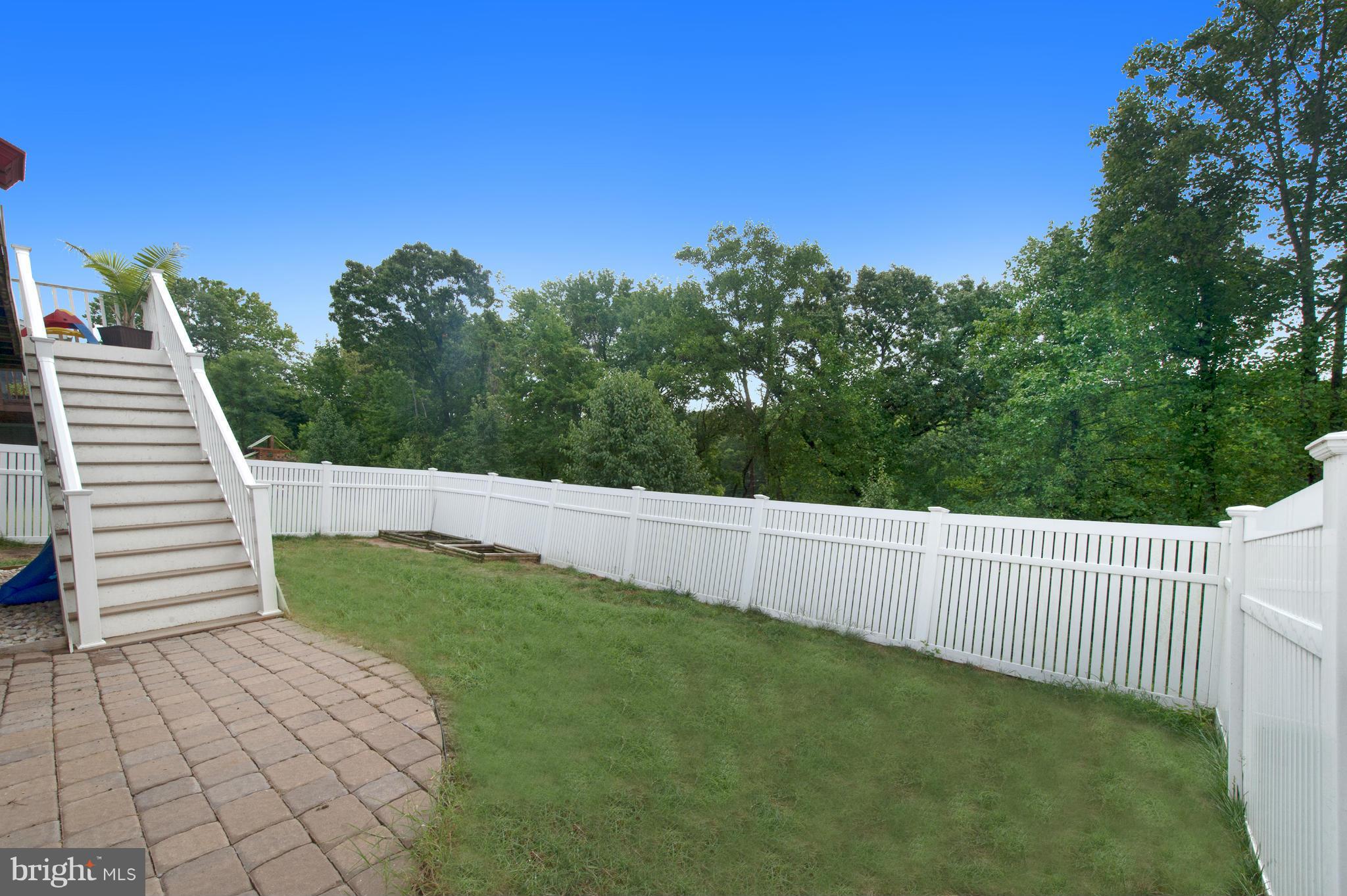 59 Haverhill Road Joppa, MD 21085 - Photo 25 of 28 a view of a backyard with grass and plants