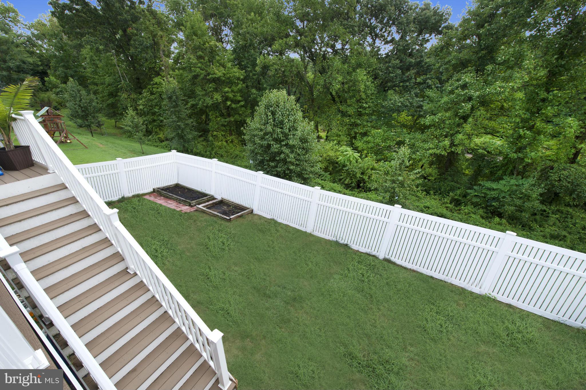 59 Haverhill Road Joppa, MD 21085 - Photo 26 of 28 a view of a backyard with wooden fence