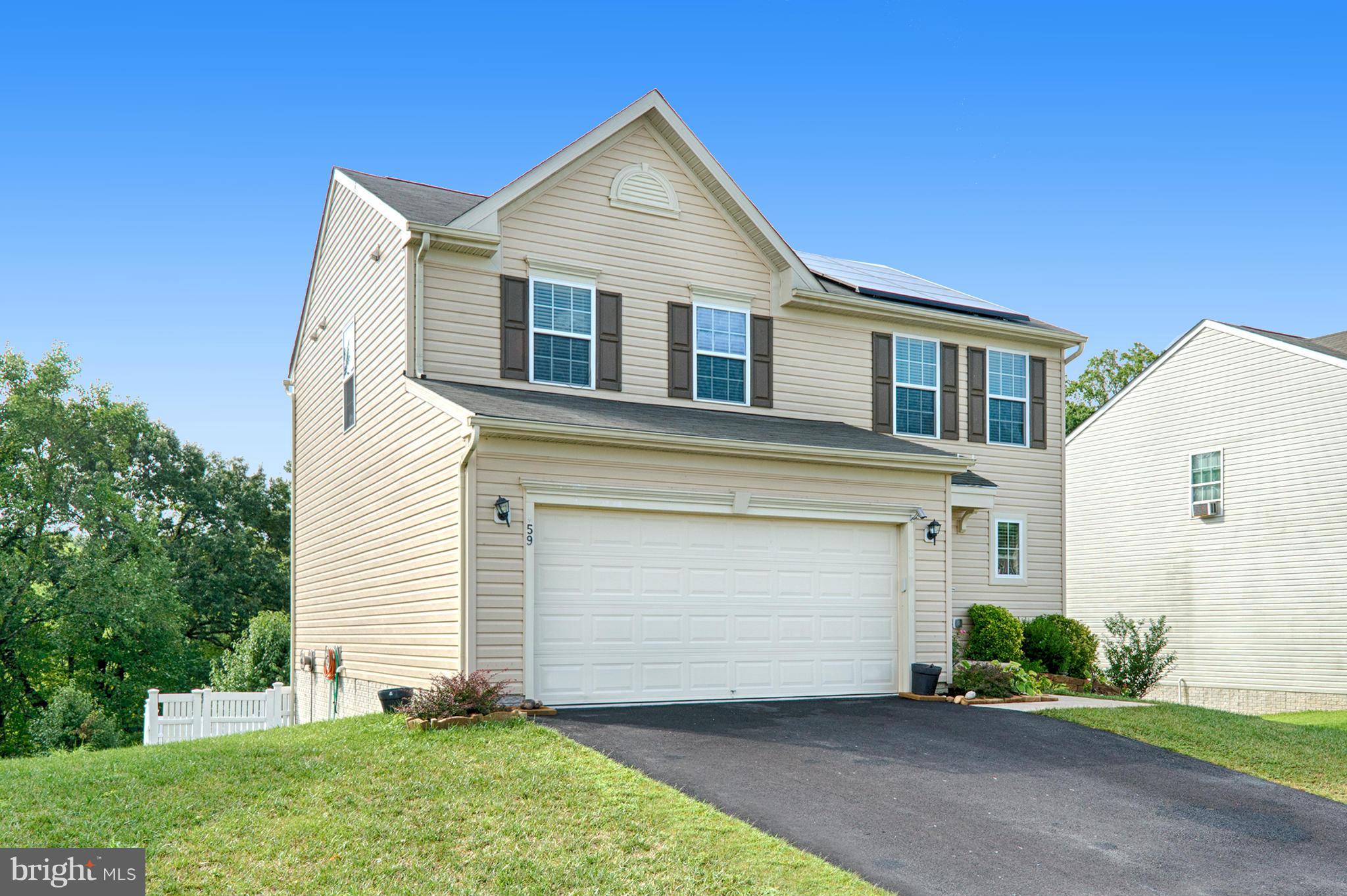 59 Haverhill Road Joppa, MD 21085 - Photo 28 of 28 a front view of a house with a yard and garage