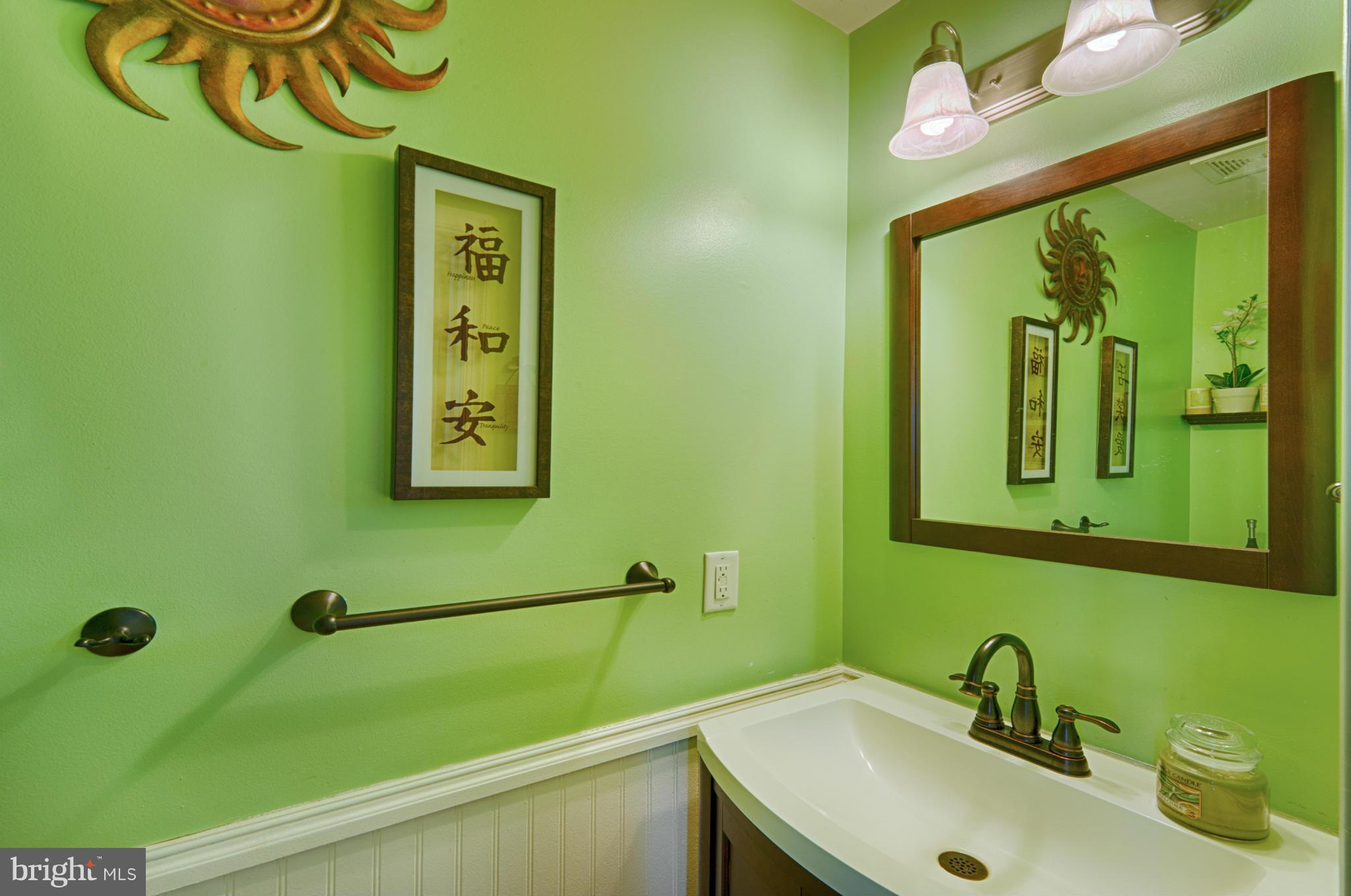 59 Haverhill Road Joppa, MD 21085 - Photo 5 of 28 a bathroom with a sink and a mirror