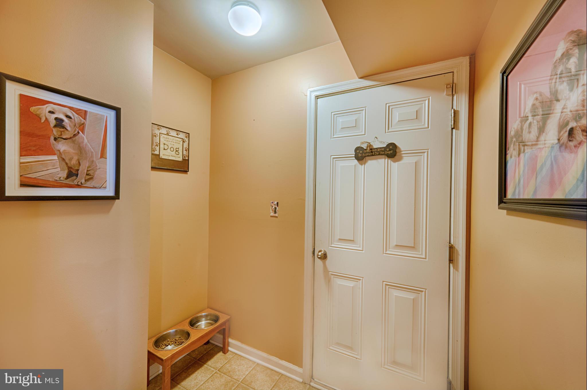 59 Haverhill Road Joppa, MD 21085 - Photo 6 of 28 a view of a hallway with paintings on the wall