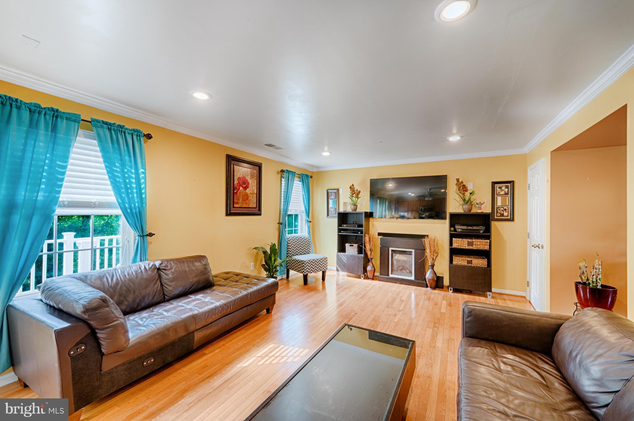 59 Haverhill Road Joppa, MD 21085 - Photo 7 of 28 a living room with furniture and a flat screen tv