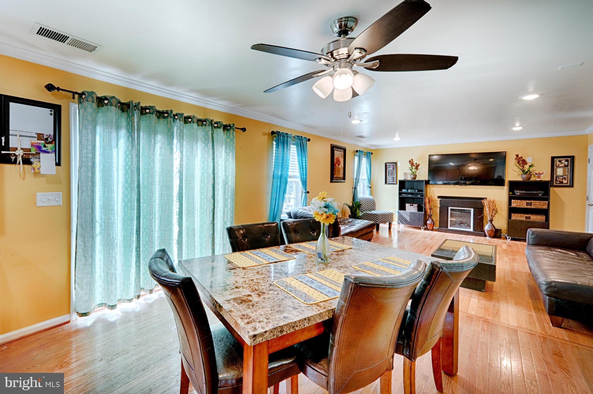 59 Haverhill Road Joppa, MD 21085 - Photo 9 of 28 a view of a dining room with furniture window and wooden floor