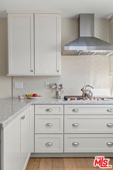 6523 Lakeridge Road Los Angeles, CA 90068 - Photo 14 of 28 a kitchen with a stove and cabinets