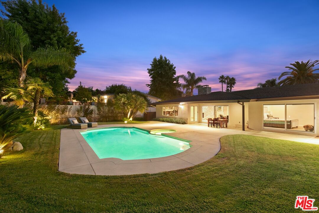 6523 Lakeridge Road Los Angeles, CA 90068 - Photo 3 of 28 a view of a swimming pool with an outdoor space and seating area