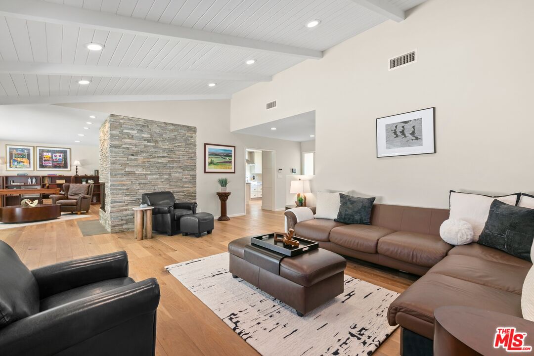 6523 Lakeridge Road Los Angeles, CA 90068 - Photo 7 of 28 a living room with furniture or couch and a fireplace