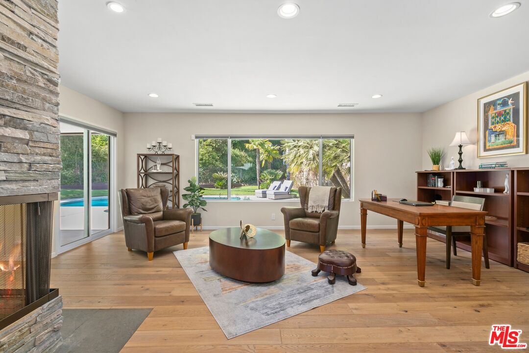 6523 Lakeridge Road Los Angeles, CA 90068 - Photo 9 of 28 a living room with furniture and a wooden floor