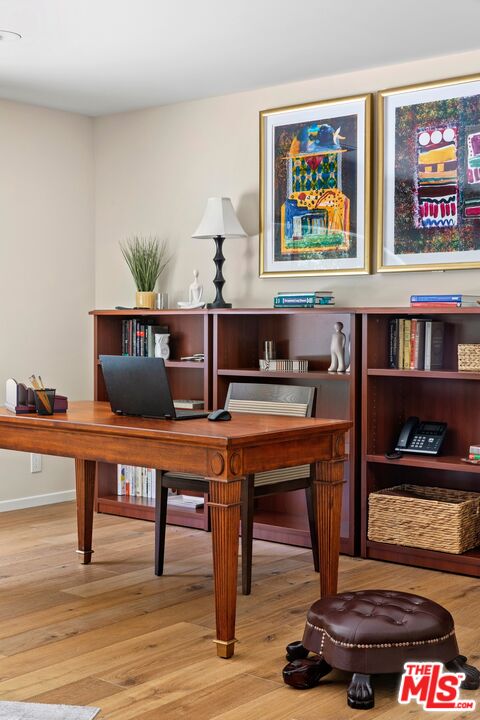 6523 Lakeridge Road Los Angeles, CA 90068 - Photo 10 of 28 a living room with furniture and paintings on the wall