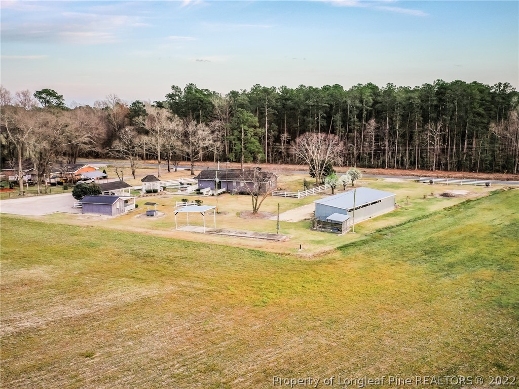 156 Pinewood Road Lumberton, NC 28358 - Photo 12 of 50 a view of a swimming pool with a patio