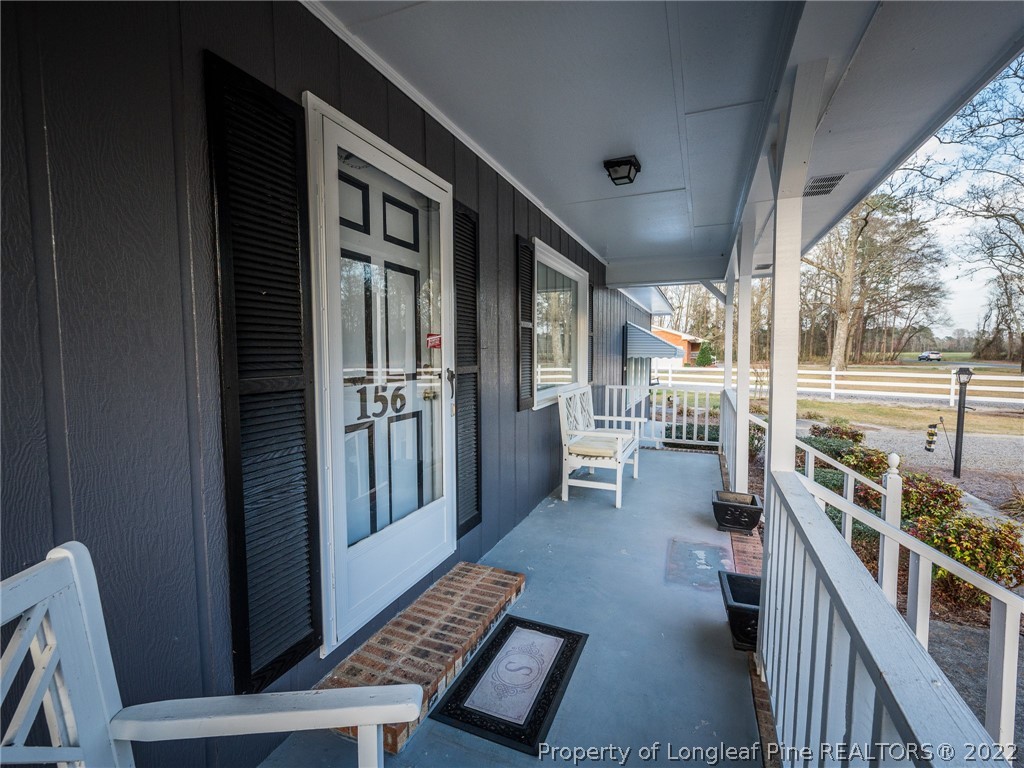 156 Pinewood Road Lumberton, NC 28358 - Photo 15 of 50 a close view of a chairs and table in the balcony