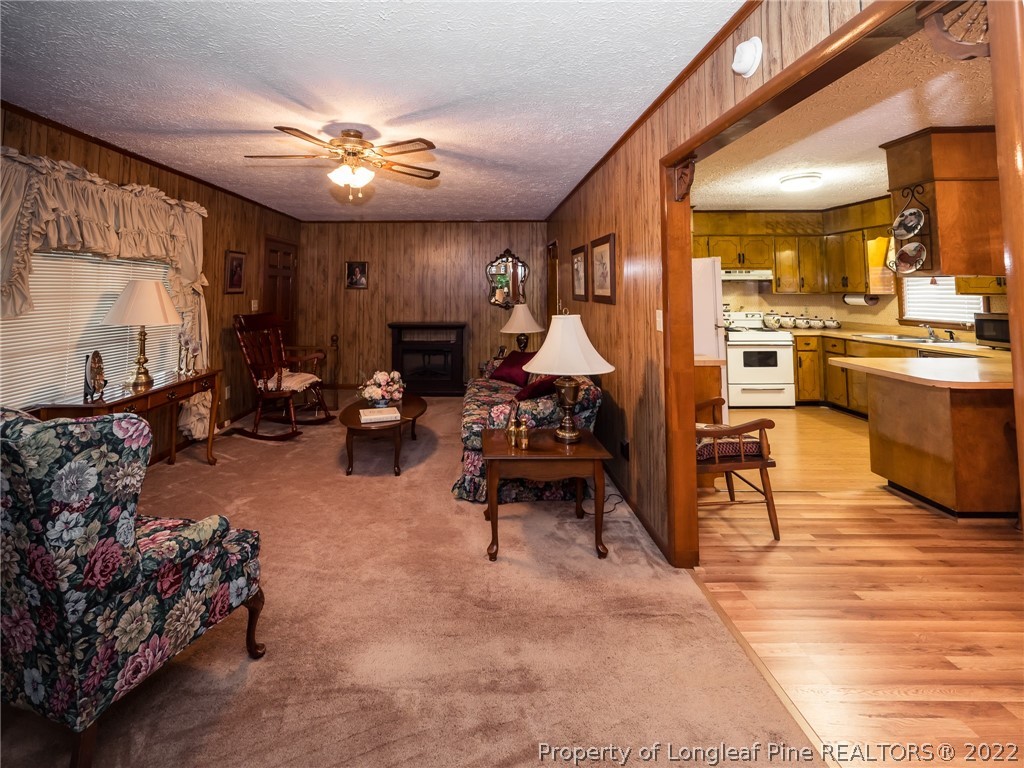 156 Pinewood Road Lumberton, NC 28358 - Photo 19 of 50 a living room with furniture and a chandelier