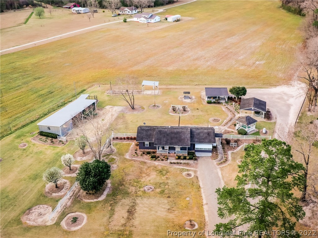 156 Pinewood Road Lumberton, NC 28358 - Photo 3 of 50 an aerial view of residential houses with outdoor space