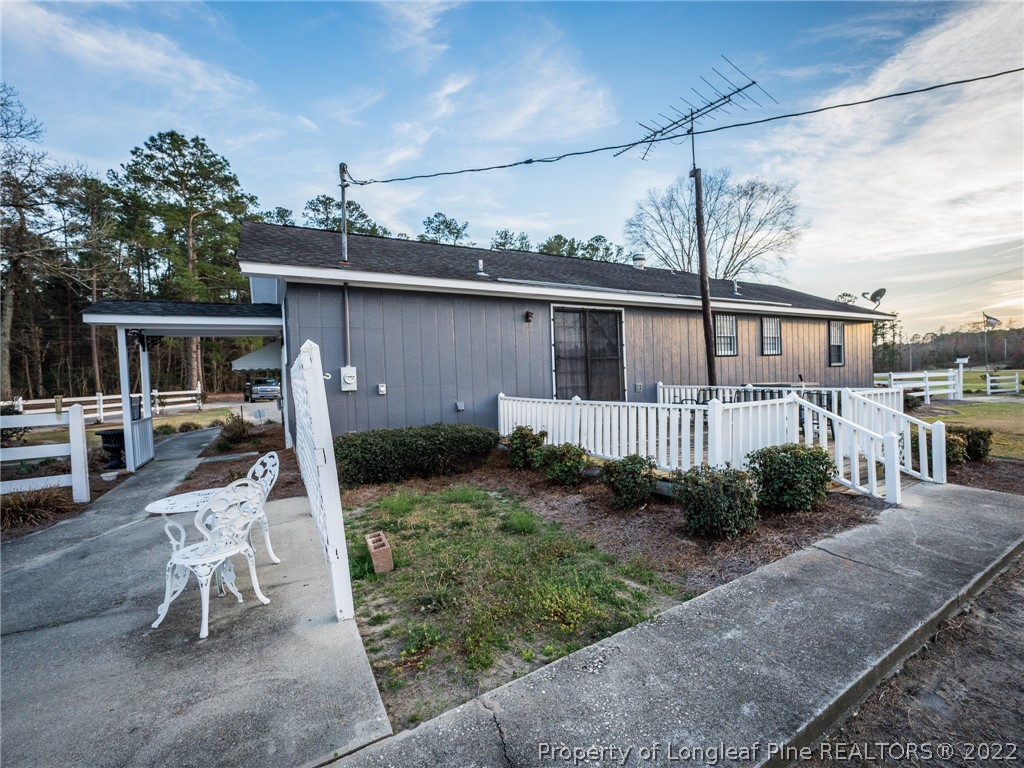 156 Pinewood Road Lumberton, NC 28358 - Photo 50 of 50 a view of a house with backyard and sitting area