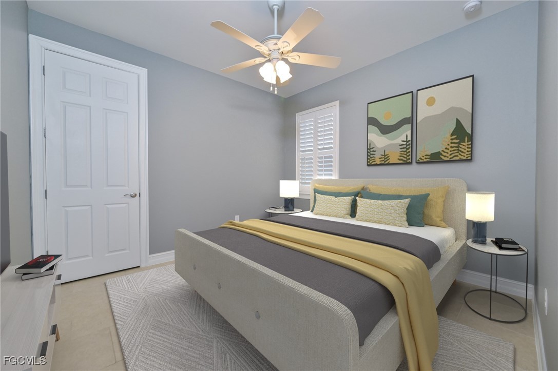 3571 Brittons Court Fort Myers, FL 33916 - Photo 23 of 42 a spacious bedroom with a bed and a chandelier