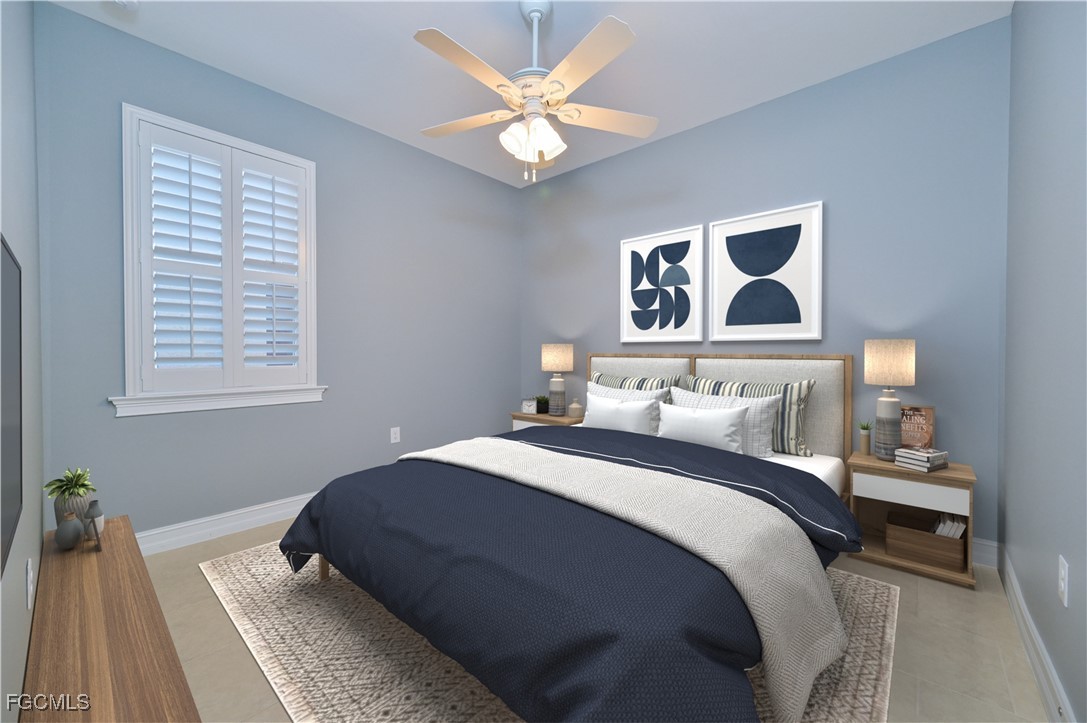 3571 Brittons Court Fort Myers, FL 33916 - Photo 27 of 42 a bedroom with a large bed and a window