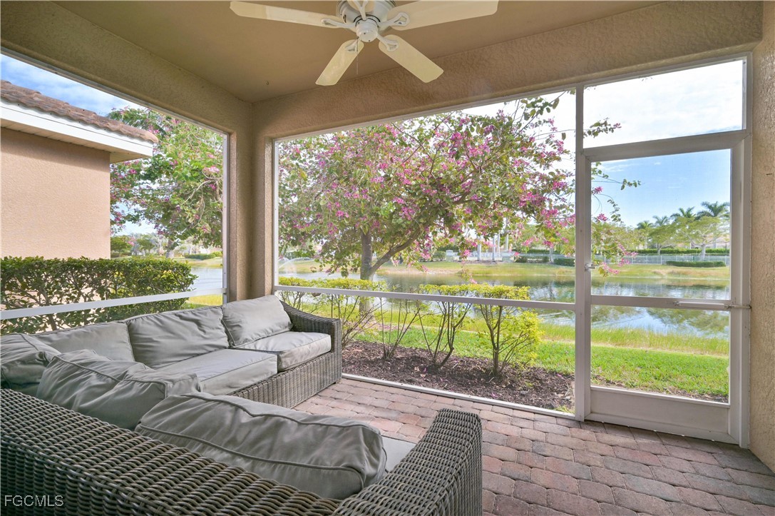 3571 Brittons Court Fort Myers, FL 33916 - Photo 31 of 42 a living room with patio furniture and a floor to ceiling window