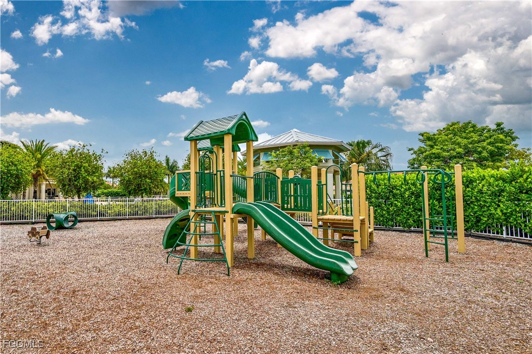 3571 Brittons Court Fort Myers, FL 33916 - Photo 37 of 42 a view of a park with swings and slides