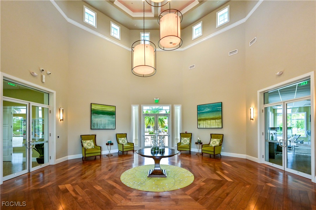 3571 Brittons Court Fort Myers, FL 33916 - Photo 40 of 42 a living room with fireplace furniture and a large window