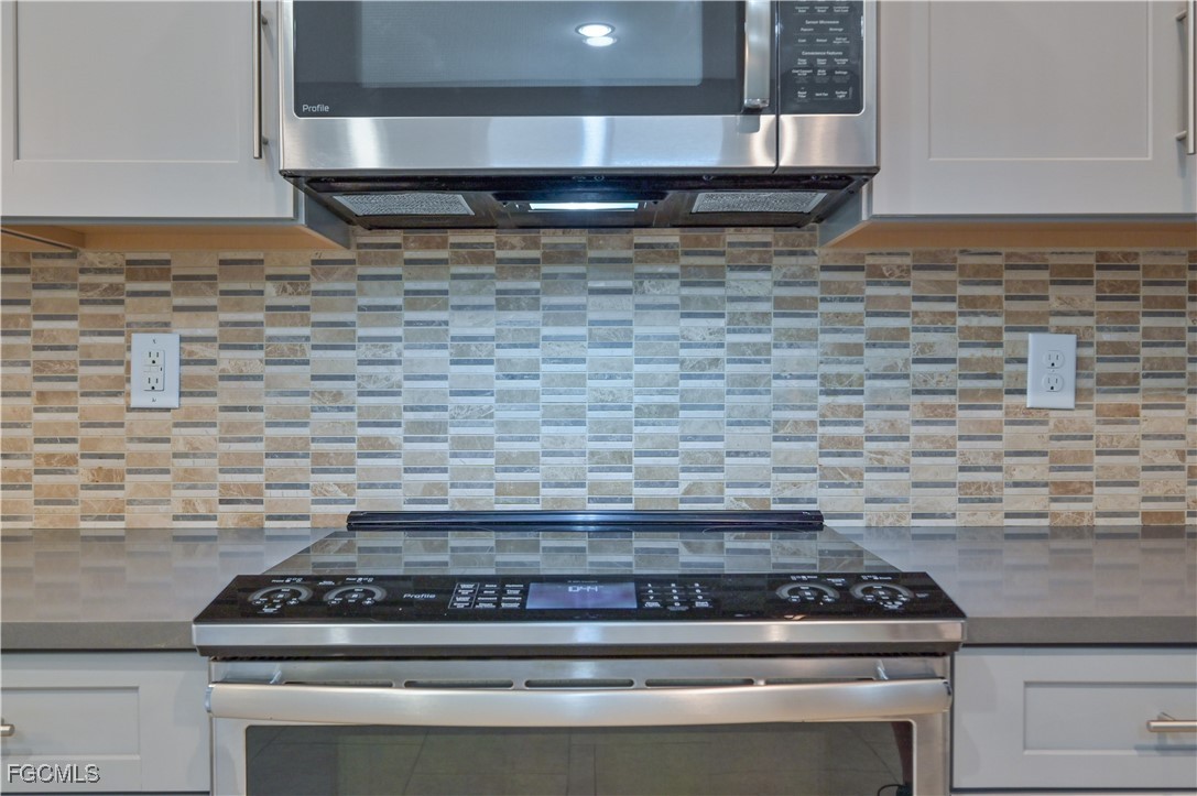 3571 Brittons Court Fort Myers, FL 33916 - Photo 4 of 42 a stove top oven sitting inside of a kitchen