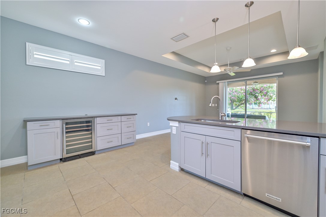 3571 Brittons Court Fort Myers, FL 33916 - Photo 5 of 42 a kitchen with granite countertop white cabinets and window