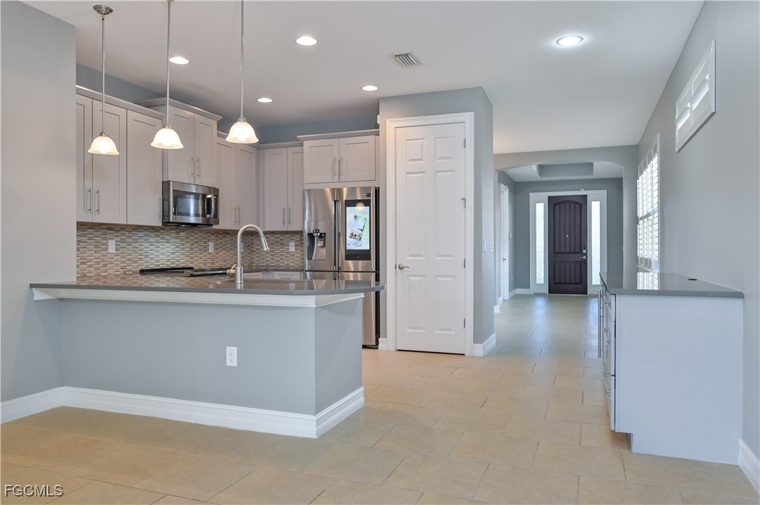3571 Brittons Court Fort Myers, FL 33916 - Photo 6 of 42 a view of kitchen with stainless steel appliances granite countertop counter space and cabinets