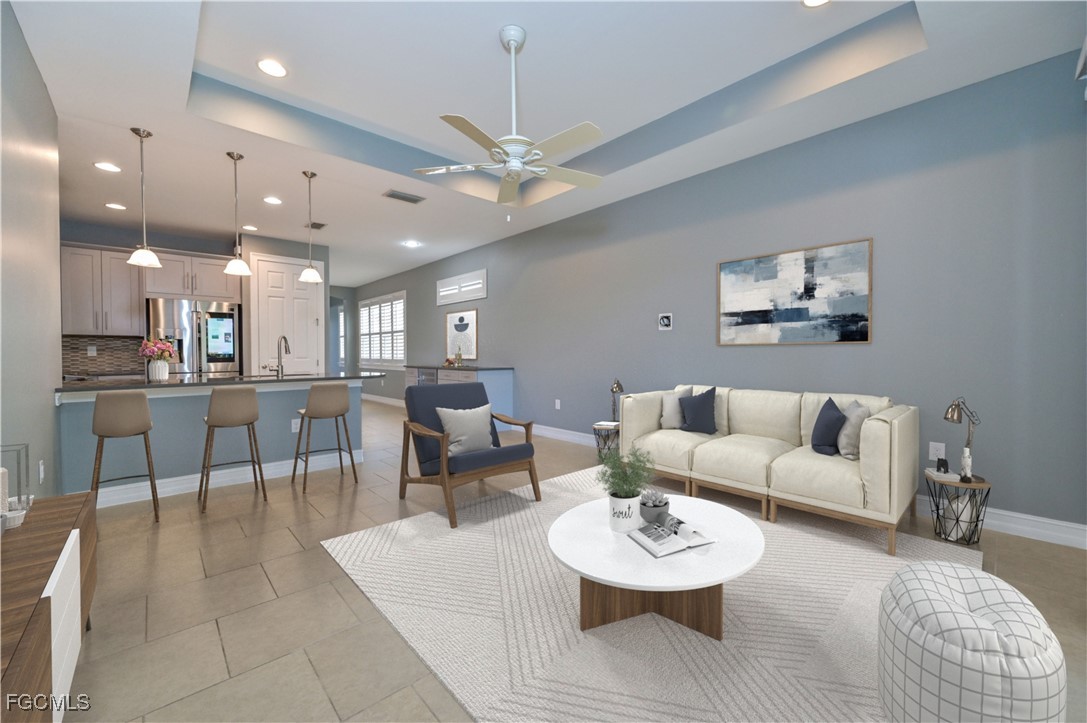 3571 Brittons Court Fort Myers, FL 33916 - Photo 9 of 42 a view of a dining room with furniture and a chandelier