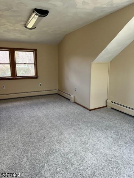 404 Stonetown Road Ringwood, NJ 07456 - Photo 10 of 13 an empty room with windows