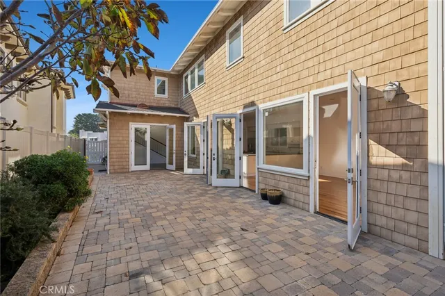 a view of a porch with a door and a chair