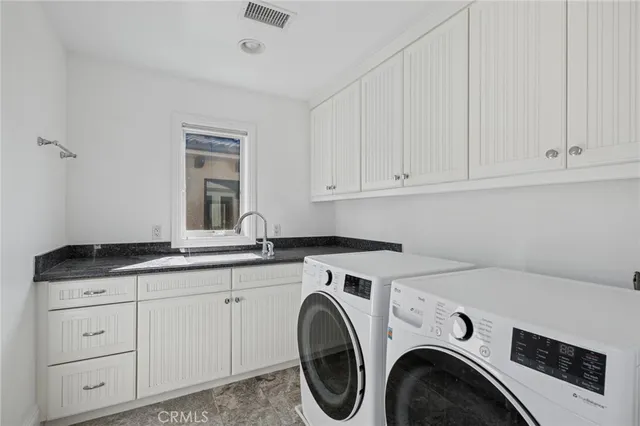 a utility room with cabinets