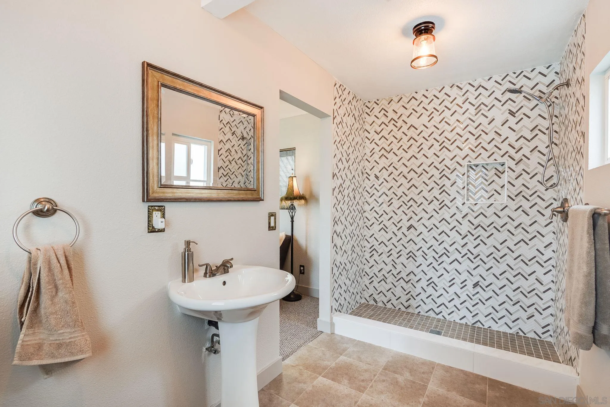 10420 Susie Place Santee, CA 92071 - Photo 14 of 26 a bathroom with a sink and mirror