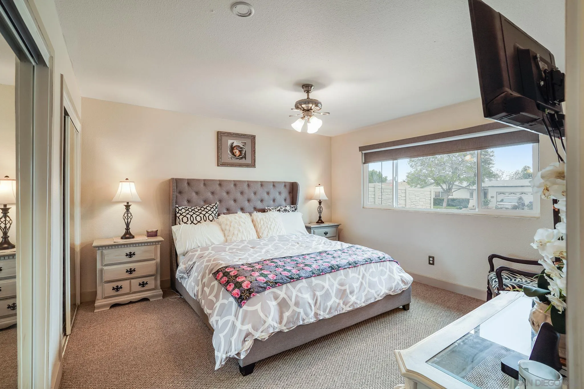 10420 Susie Place Santee, CA 92071 - Photo 15 of 26 a bedroom with a bed a chandelier and a window