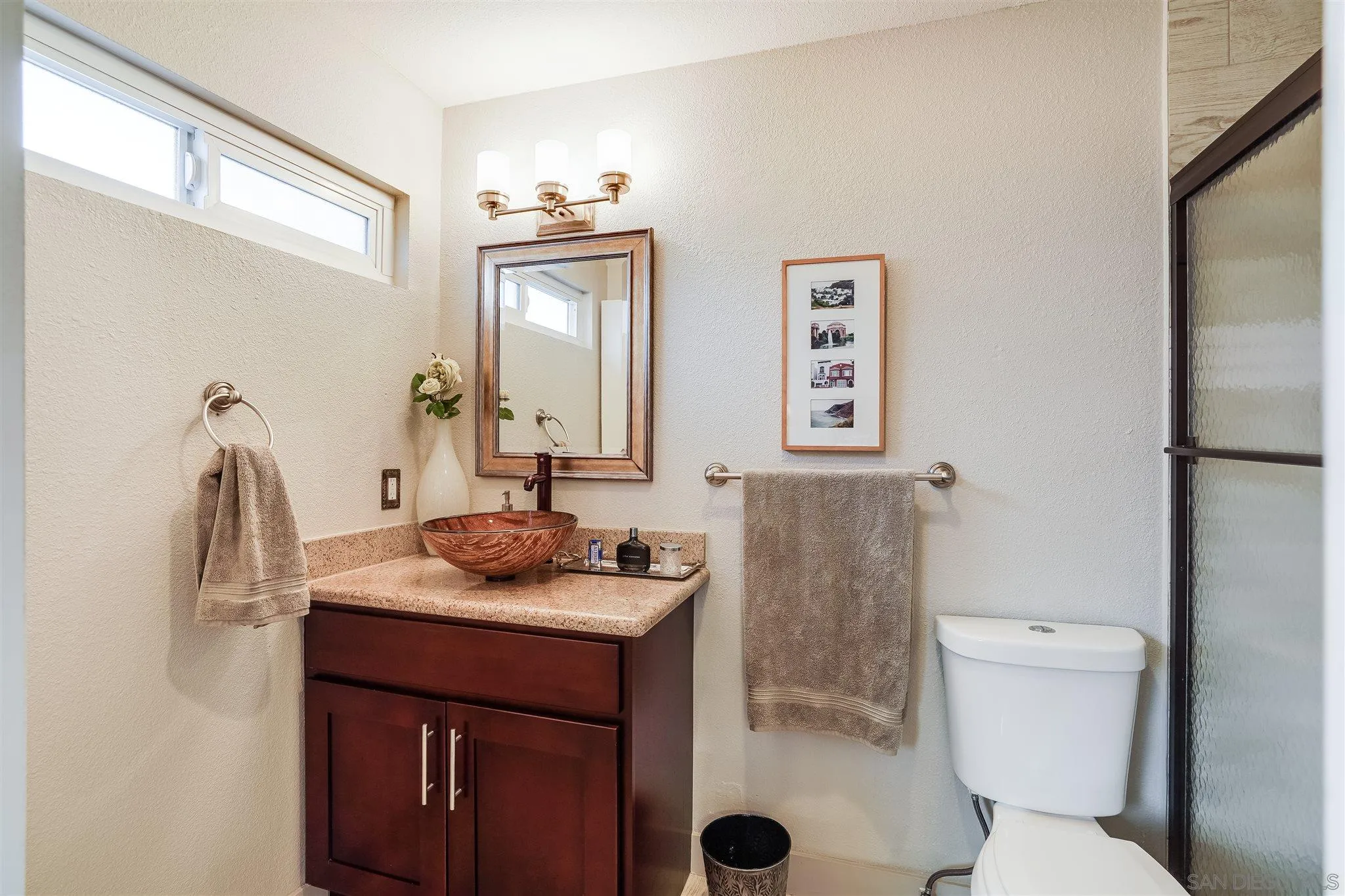 10420 Susie Place Santee, CA 92071 - Photo 18 of 26 a bathroom with a granite countertop sink toilet and mirror