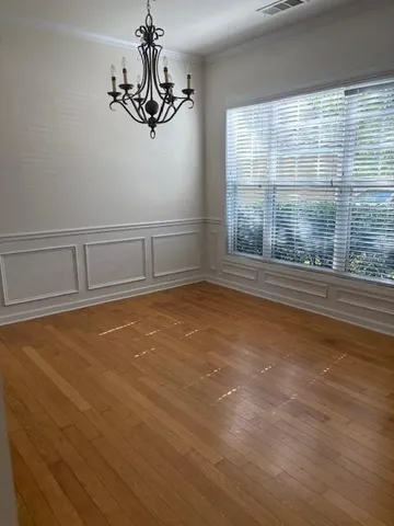 a view of a room with window wooden floor and windows