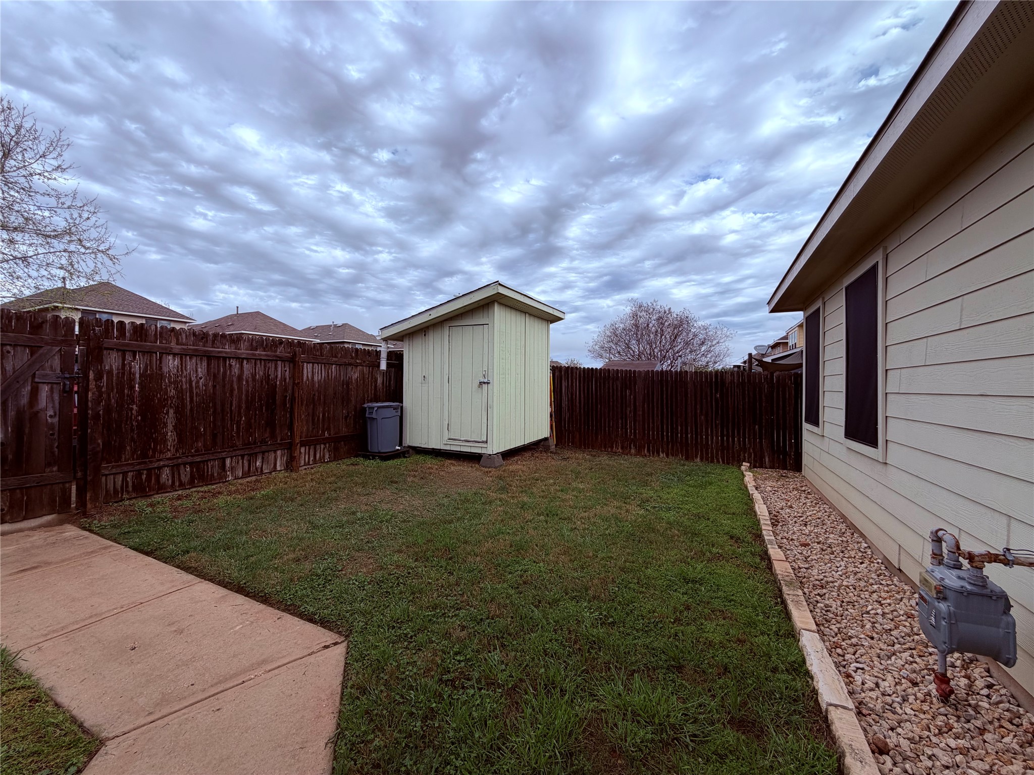 4508 Kind Way, Unit 249 Austin, TX 78725 - Photo 18 of 20 Fenced in backyard with 2 storage units!