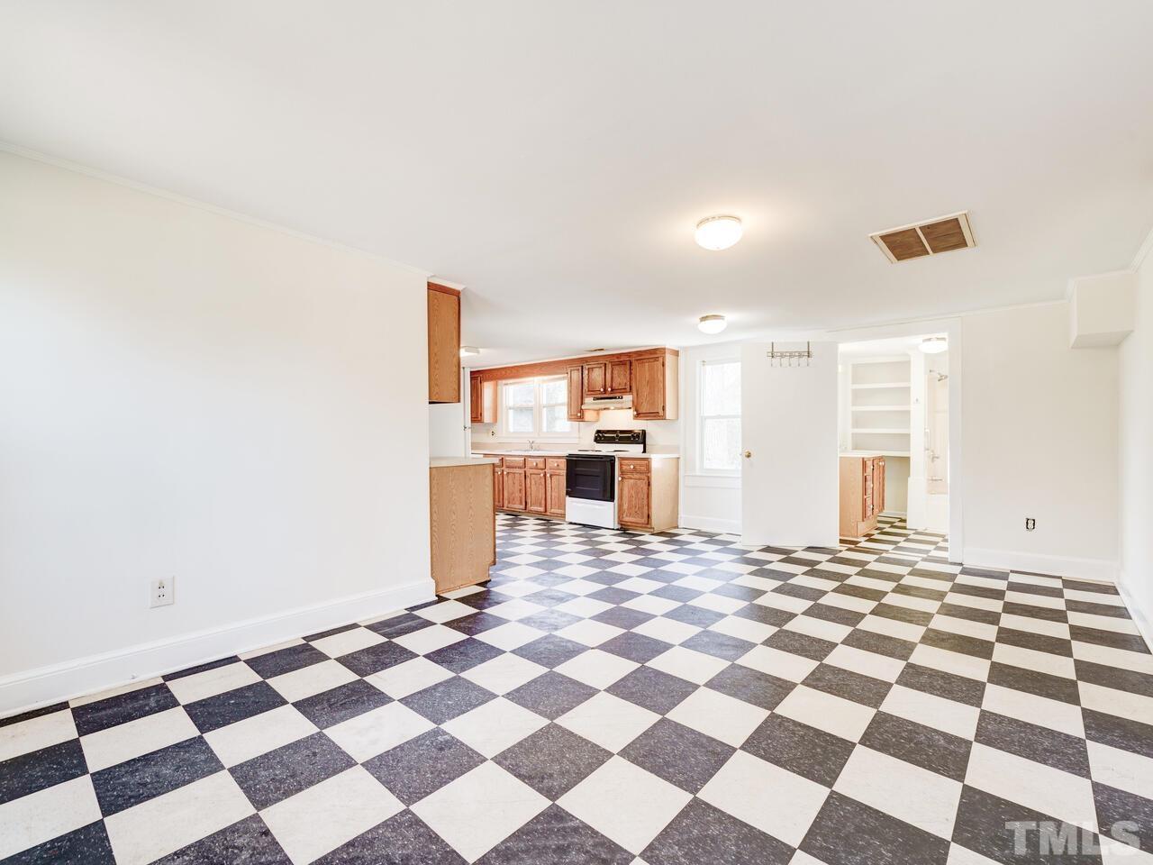 269 Hesters Store Road Roxboro, NC 27574 - Photo 15 of 30 a living room with a black white checkered floor with a black white checkered floor