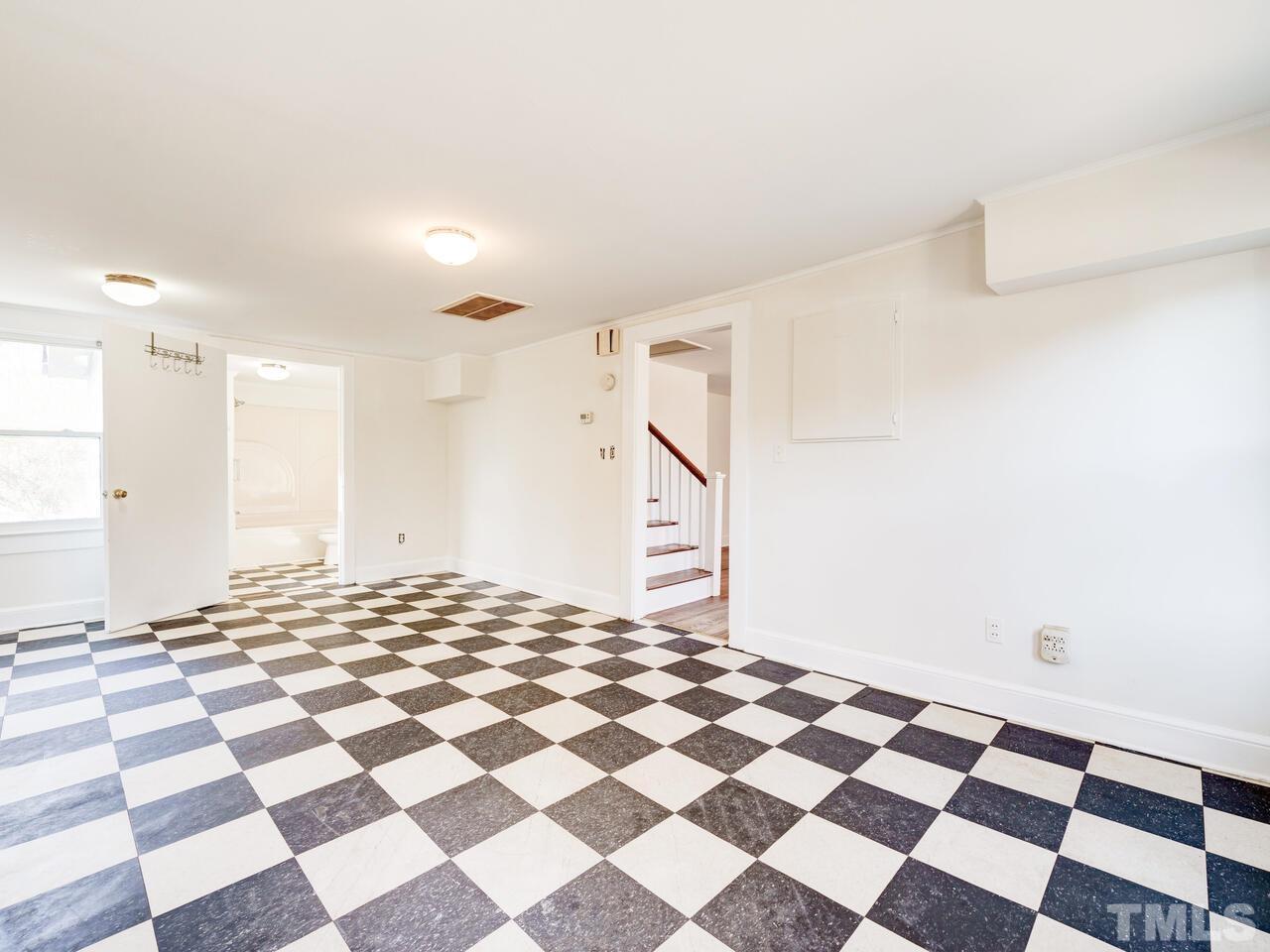 269 Hesters Store Road Roxboro, NC 27574 - Photo 16 of 30 a view of a room with a black and white checkered floor