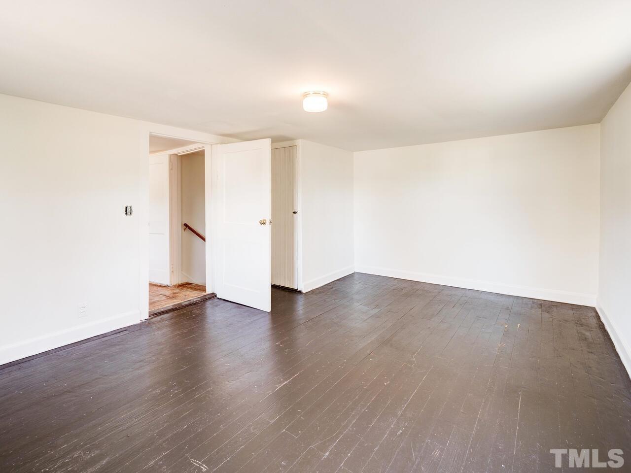 269 Hesters Store Road Roxboro, NC 27574 - Photo 20 of 30 a view of an empty room with wooden floor