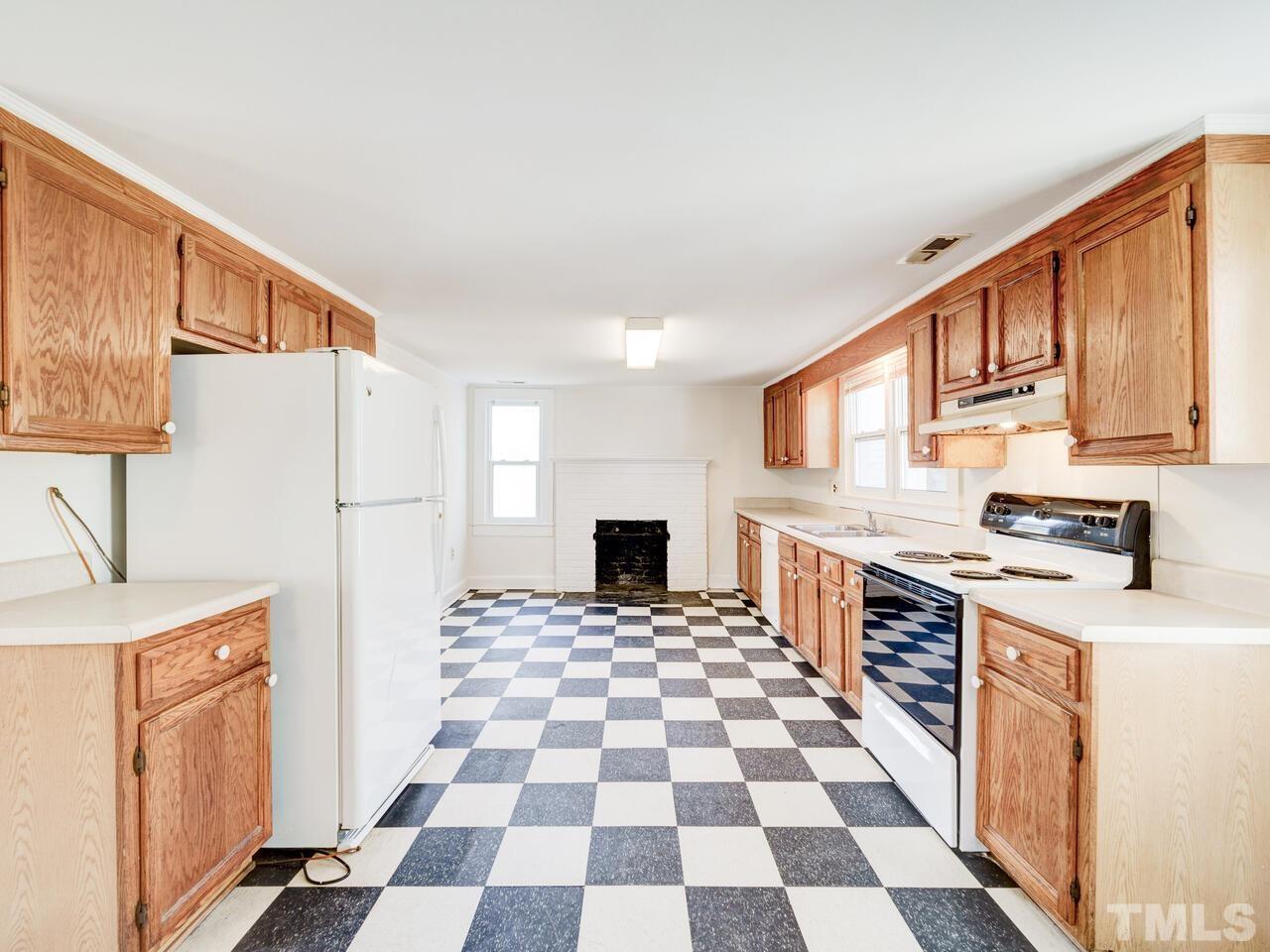 269 Hesters Store Road Roxboro, NC 27574 - Photo 2 of 30 a kitchen with a stove a sink and a refrigerator
