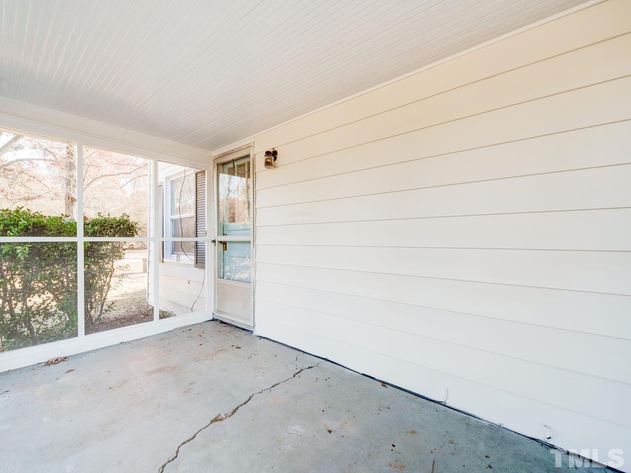 269 Hesters Store Road Roxboro, NC 27574 - Photo 22 of 30 a view of empty room with floor to ceiling window