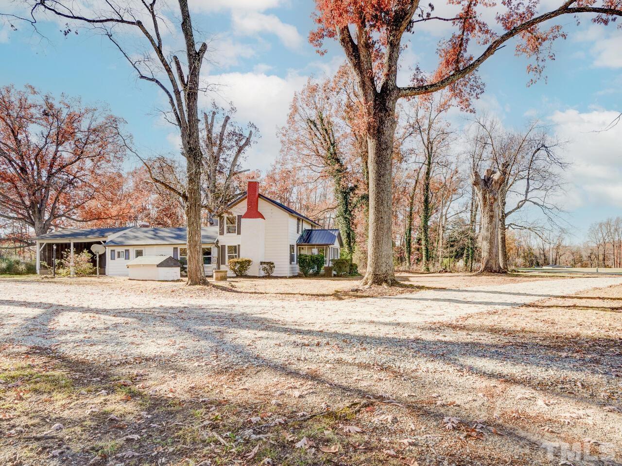 269 Hesters Store Road Roxboro, NC 27574 - Photo 27 of 30 front view of a house with a trees