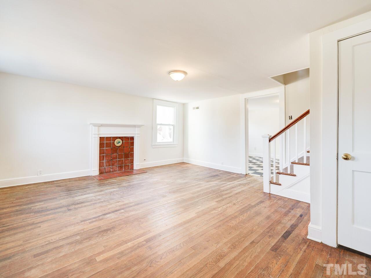 269 Hesters Store Road Roxboro, NC 27574 - Photo 3 of 30 a view of empty room with wooden floor and fan