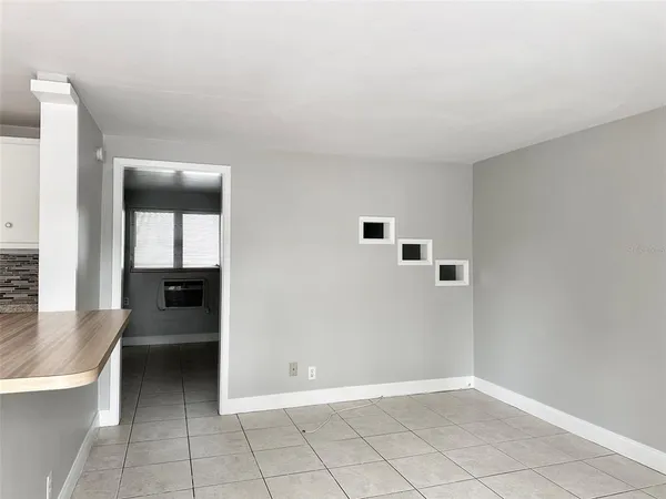 a view of kitchen with a sink and dishwasher cabinets with wooden floor