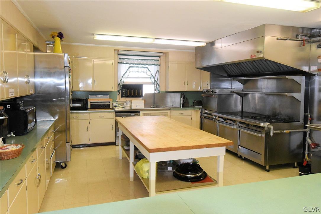 616 4th Bethlehem, PA 18015 - Photo 21 of 50 a kitchen with stainless steel appliances kitchen island a stove and a sink