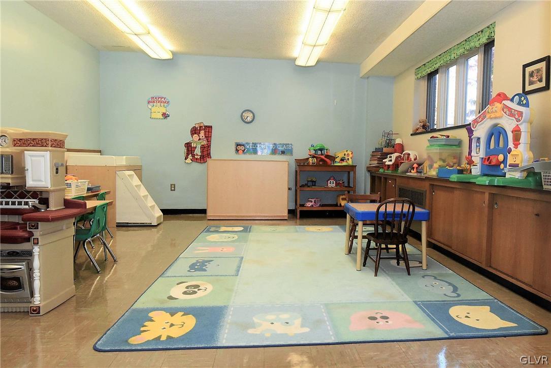 616 4th Bethlehem, PA 18015 - Photo 24 of 50 a living room with furniture and a dining table with wooden floor