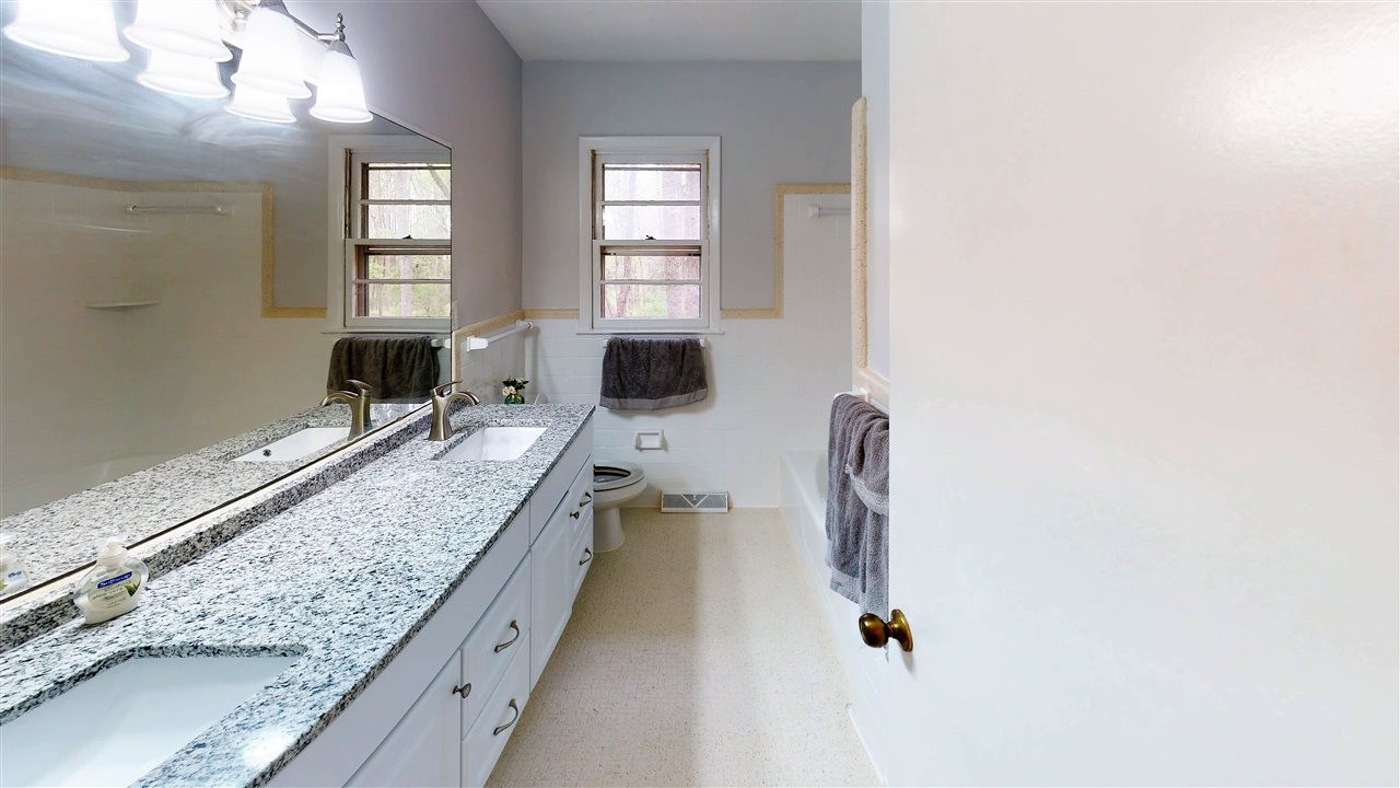 108 Rand Road Raleigh, NC 27603 - Photo 15 of 29 New dual Granite Vanity and large mirror make sharing easy. 2nd Bathroom