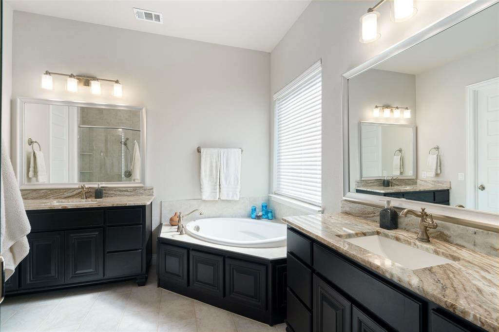 191 Daniel Drive Van Alstyne, TX 75495 - Photo 12 of 30 a bathroom with 2 sink and a mirror