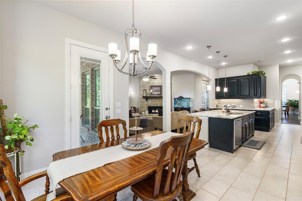 191 Daniel Drive Van Alstyne, TX 75495 - Photo 17 of 30 a large kitchen with a table and chairs