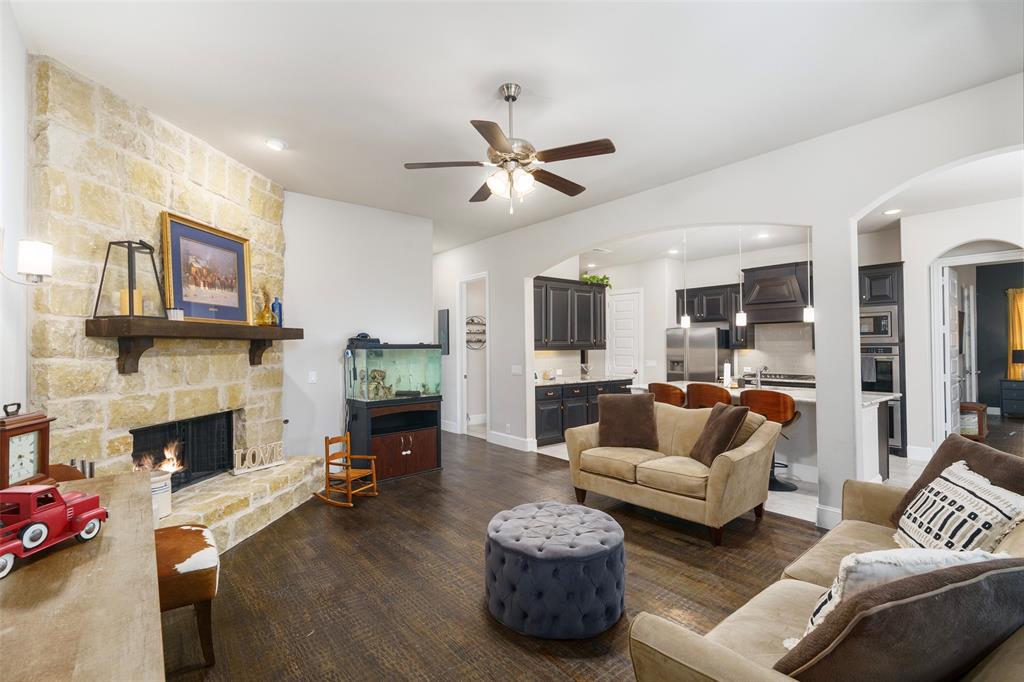 191 Daniel Drive Van Alstyne, TX 75495 - Photo 19 of 30 a living room with furniture and a fireplace
