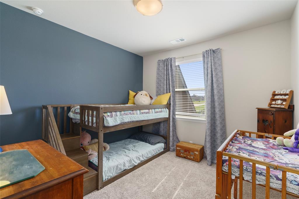 191 Daniel Drive Van Alstyne, TX 75495 - Photo 20 of 30 a bedroom with furniture and a window