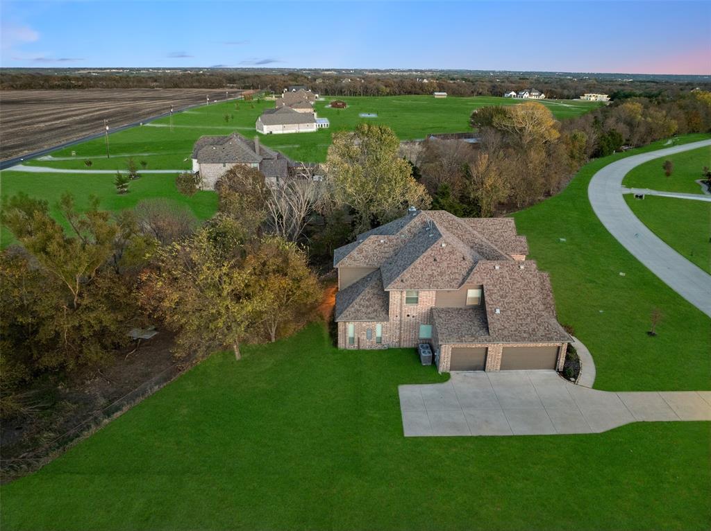 191 Daniel Drive Van Alstyne, TX 75495 - Photo 6 of 30 an aerial view of a house with a garden and lake view